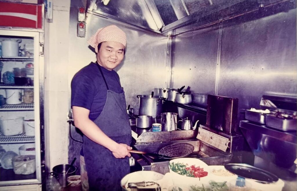 “Chef Simon working in Thai restaurant kitchen in Melbourne Australia”